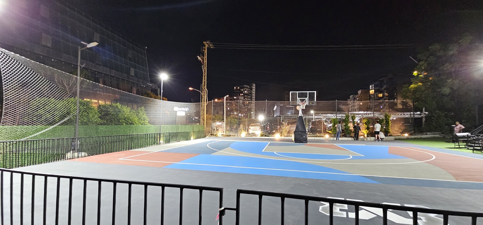 Floodlit basketball court with perimeter netting by TurfFix Pro in Lebanon