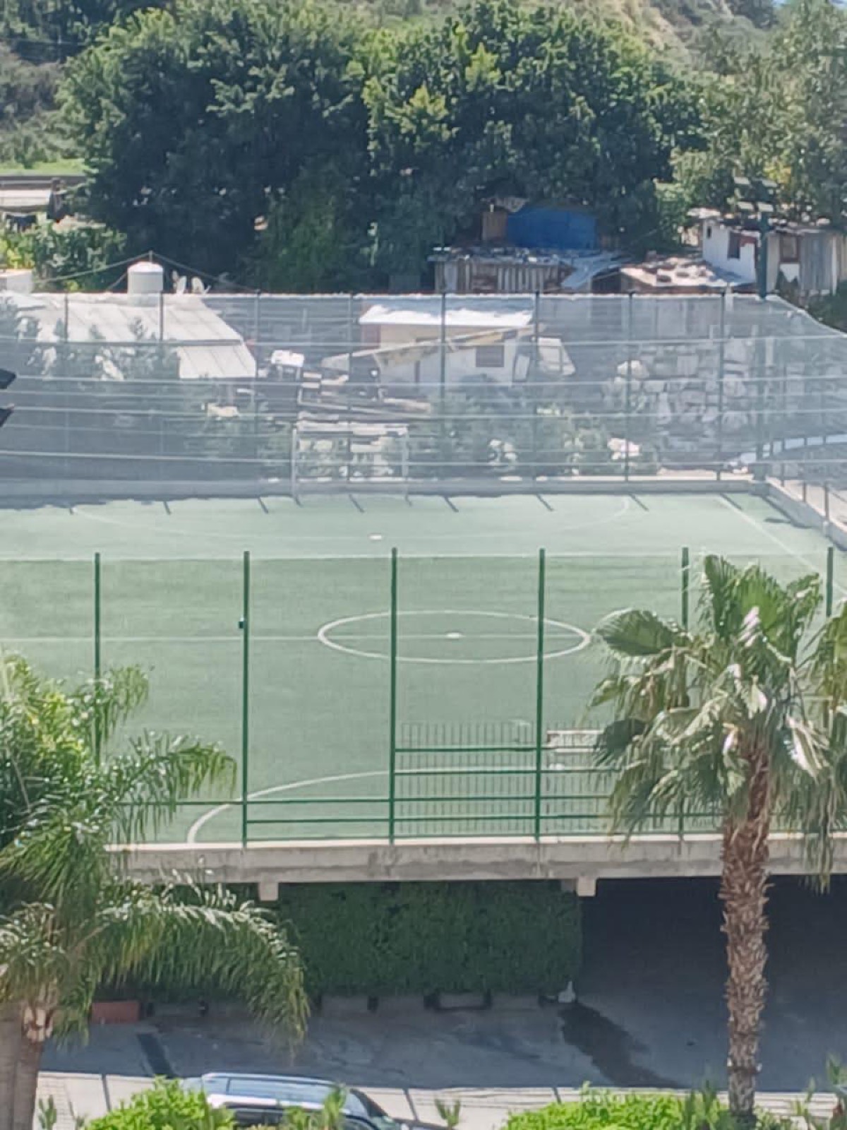 Aerial view of a finished court with full perimeter netting in Lebanon